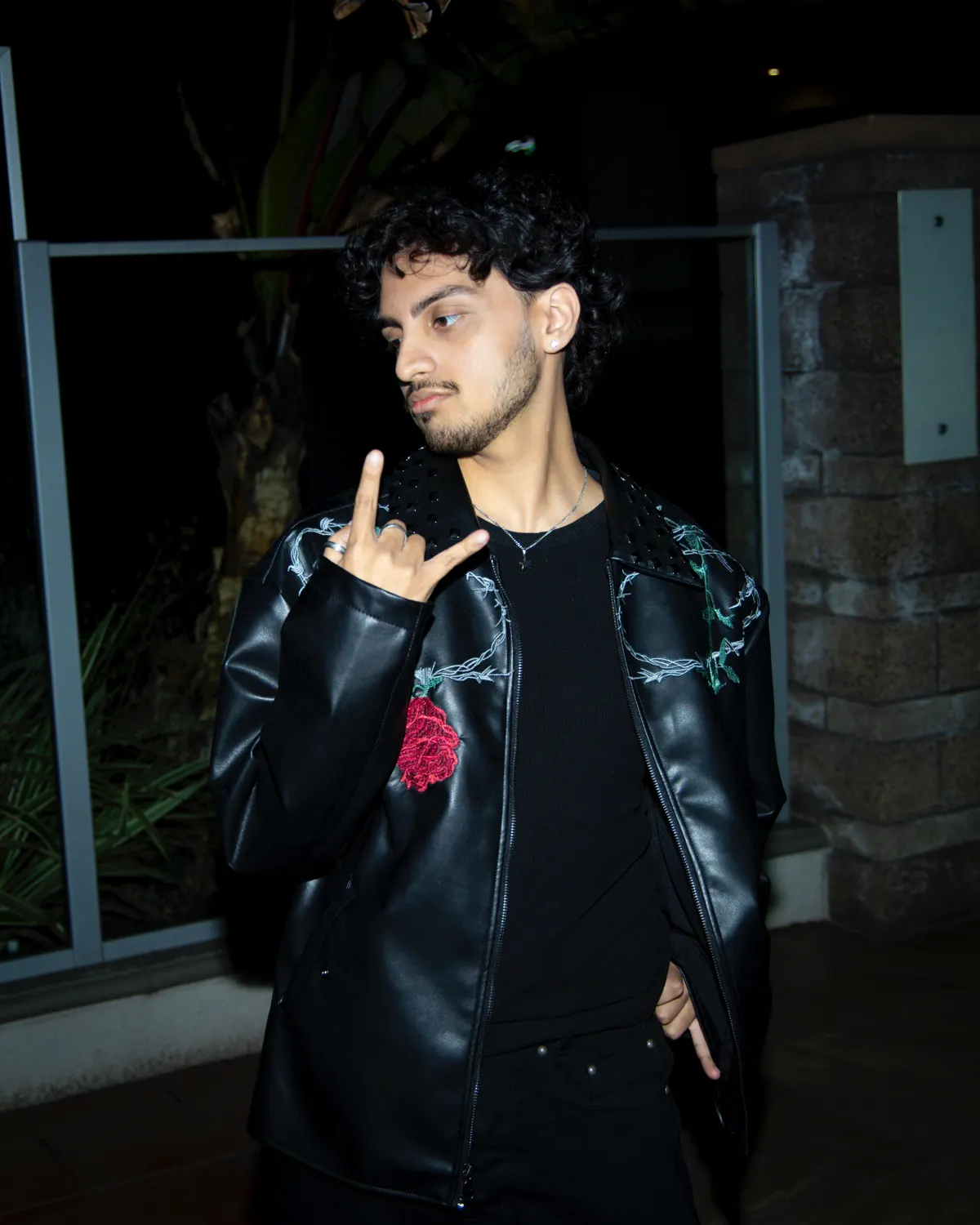 Lost in a black leather jacket at night